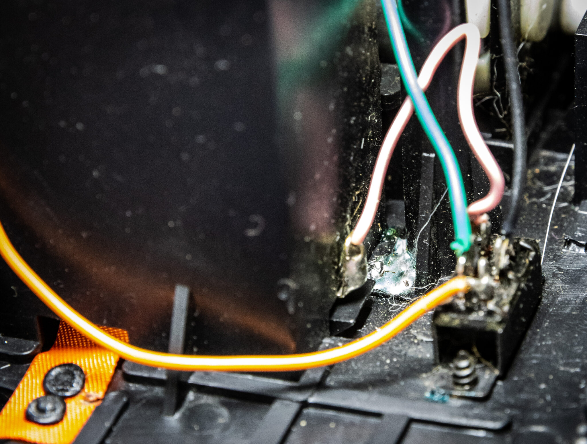A photo of solder dripped inside a Petster case